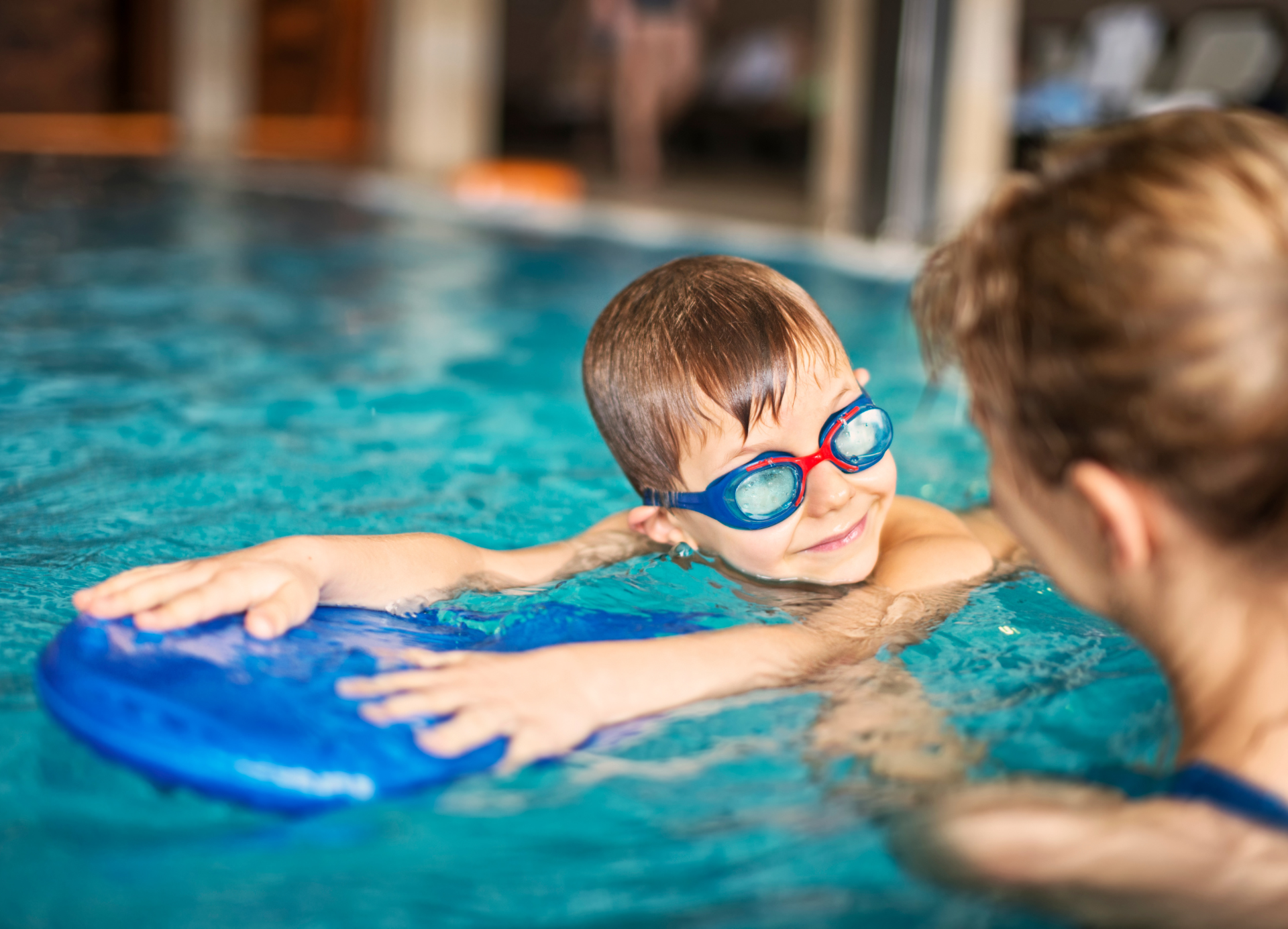 kid at swimming lessons